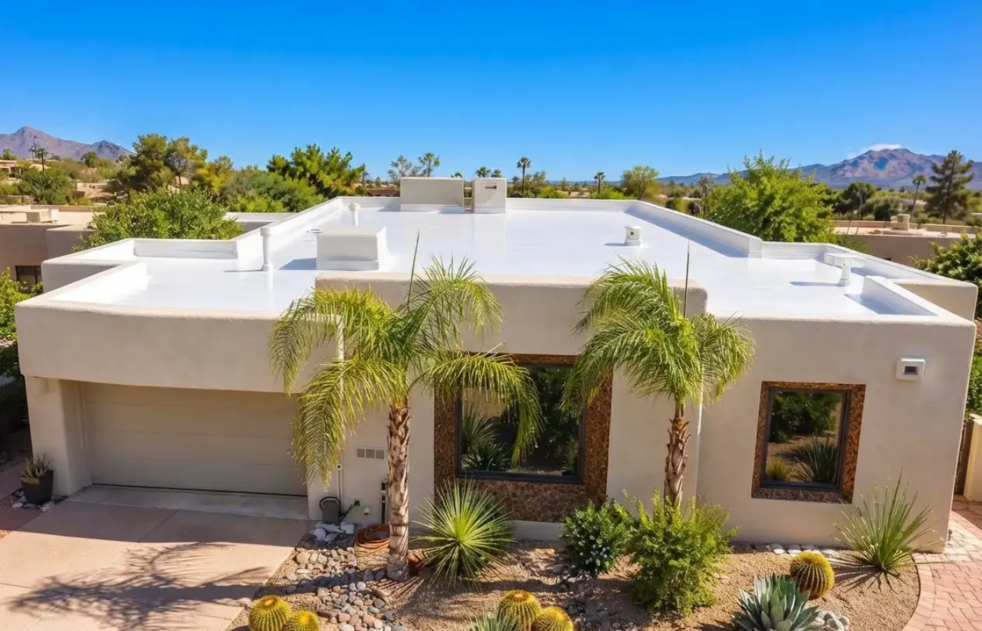 Front view of a stucco home with a flat roofline