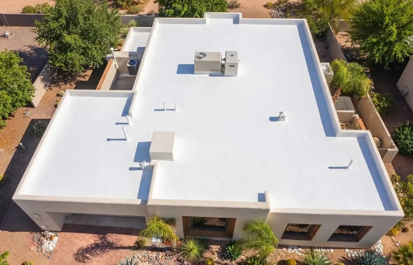 Close view of a stucco home and desert landscaping